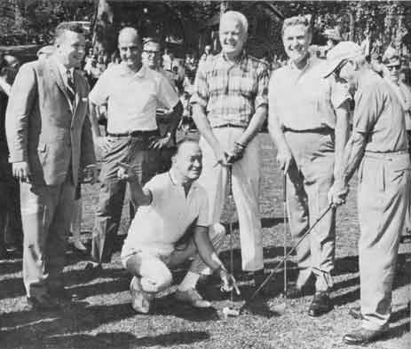 Bob Hope lines up a shot for Charles Tooth, president of the U. S. Blind Golfers Foundation